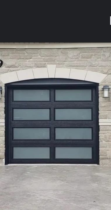 A Mor Garage Doors technician's completed installation on a Newmarket home